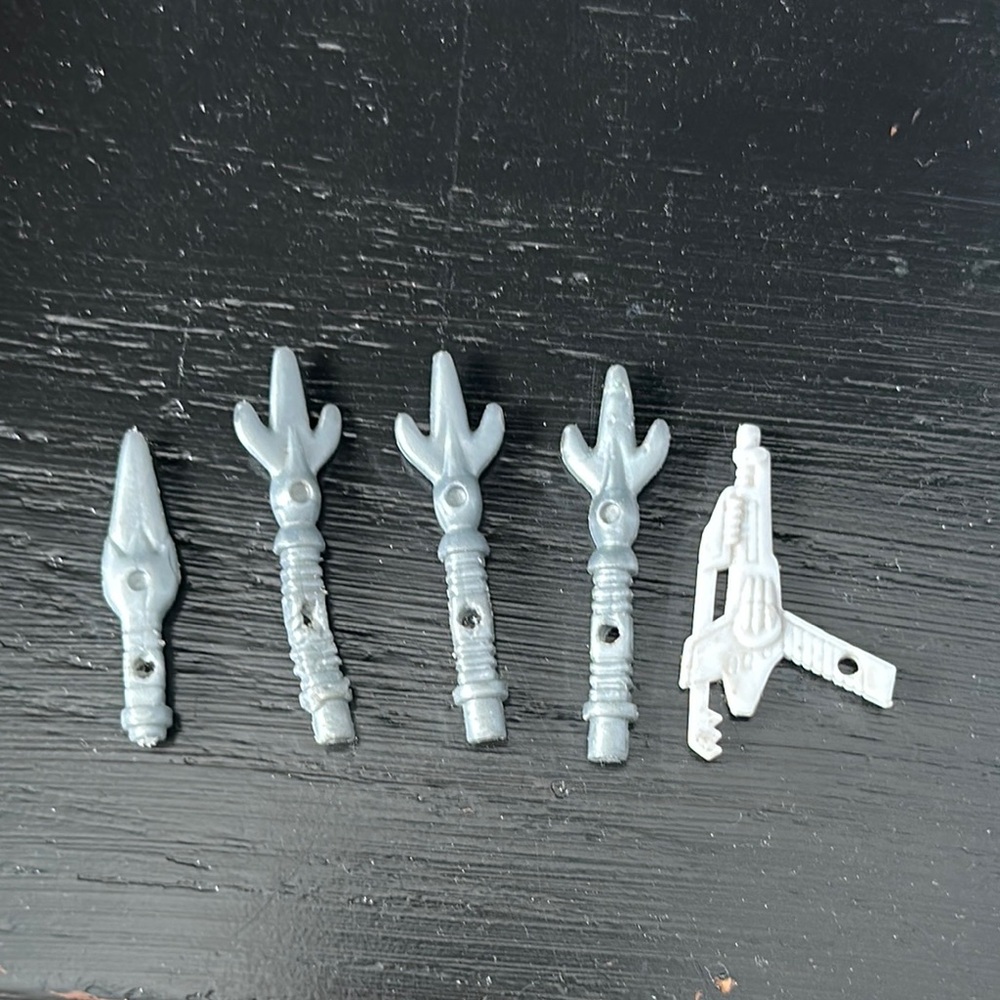 Power Rangers weapons set. 3 tridents, I small sword and a laser.